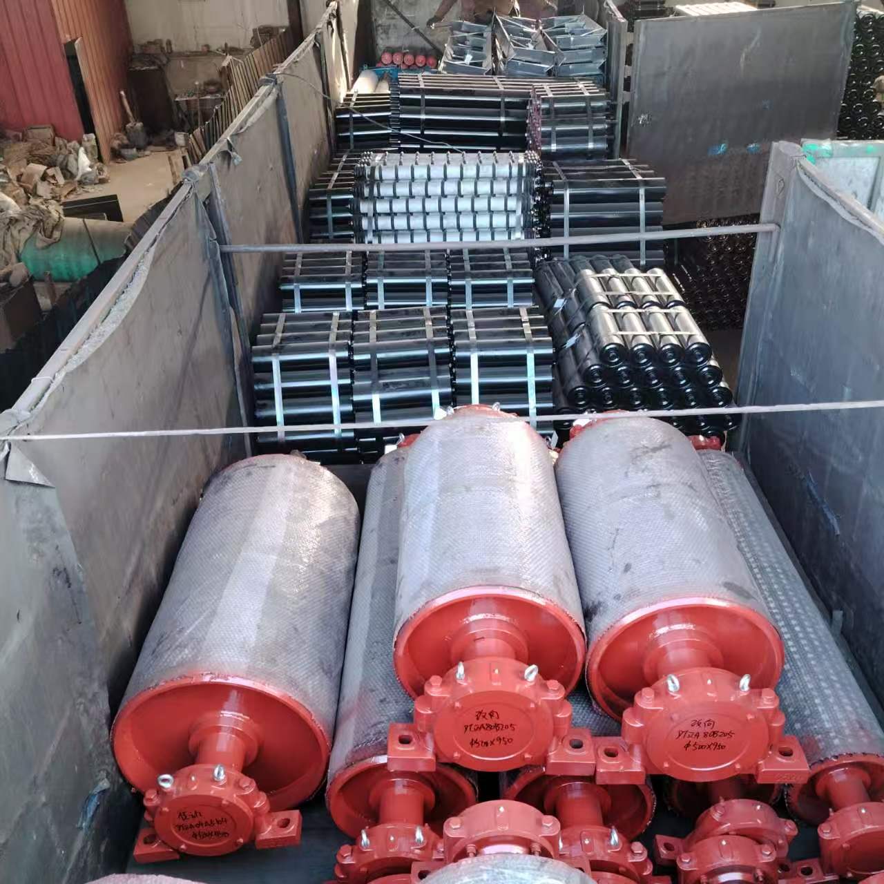Conveyor pulleys and idlers prepared for delivery.