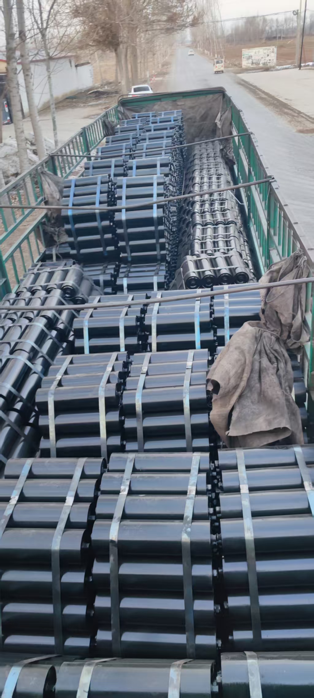 Conveyor idlers prepared for delivery.